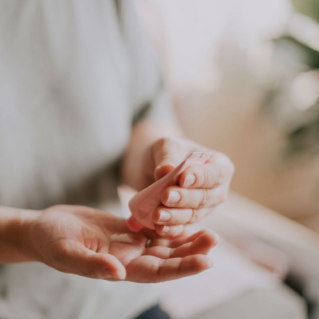 Banner image of cream being used on hand Mobile