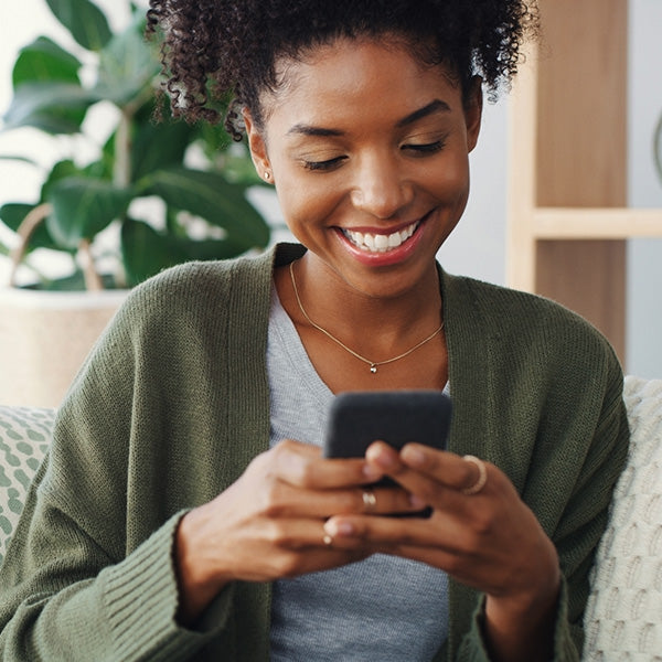 Lady using a cell phone for support