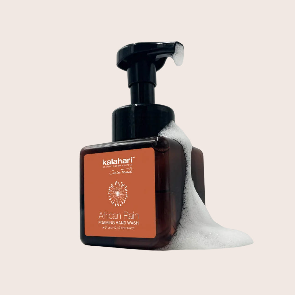 Kalahari African Rain foaming hand wash bottle with pump and soap suds on a white background