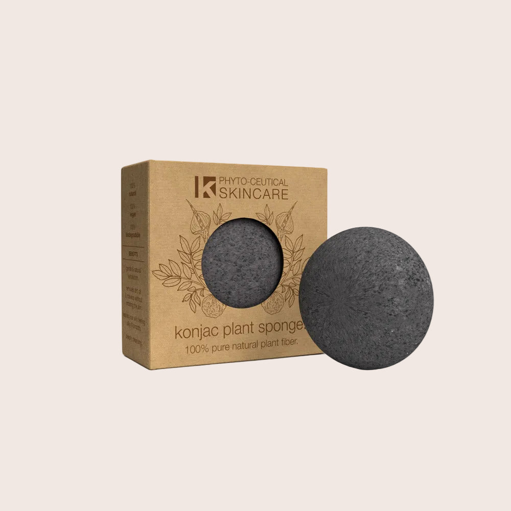 Konjac plant sponge with brown packaging on a white background